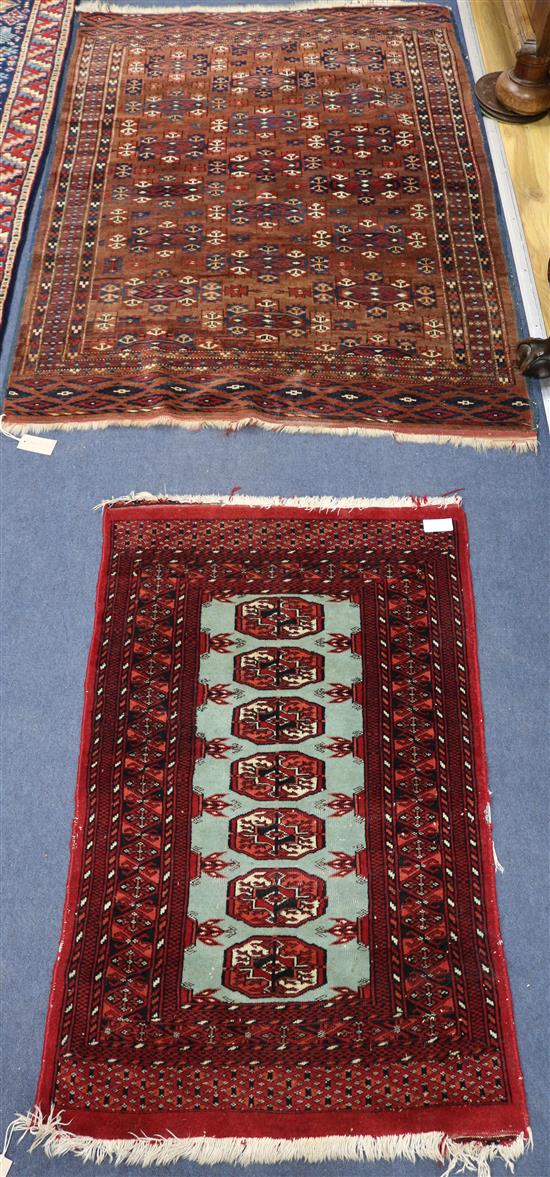 A Bokhara style mat and a rug sft 3in x 2ft 1in and 4ft 11in x 3ft 4in.